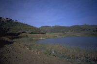 Image thumbnail: Panorama, south to north, looking west; southern Spitalla reservoir, looking west with naval station on coastal ridge in distance; zone 8